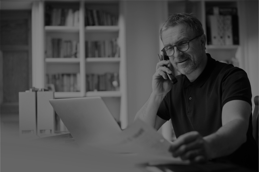 Man on Phone with Document