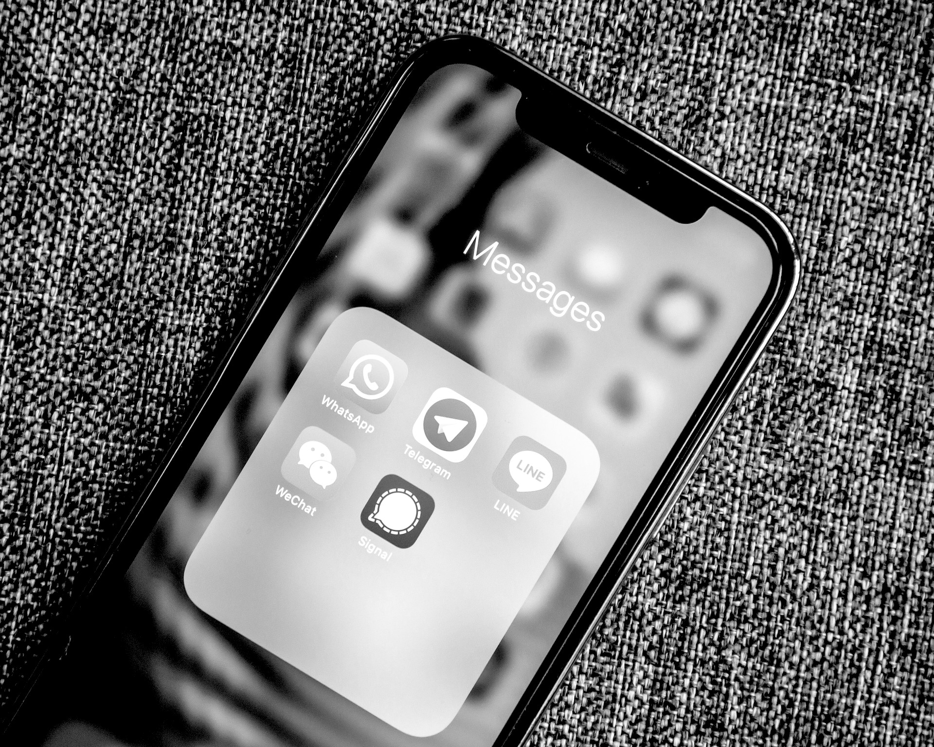 A stock photo of an iPhone displaying a folder entitled 