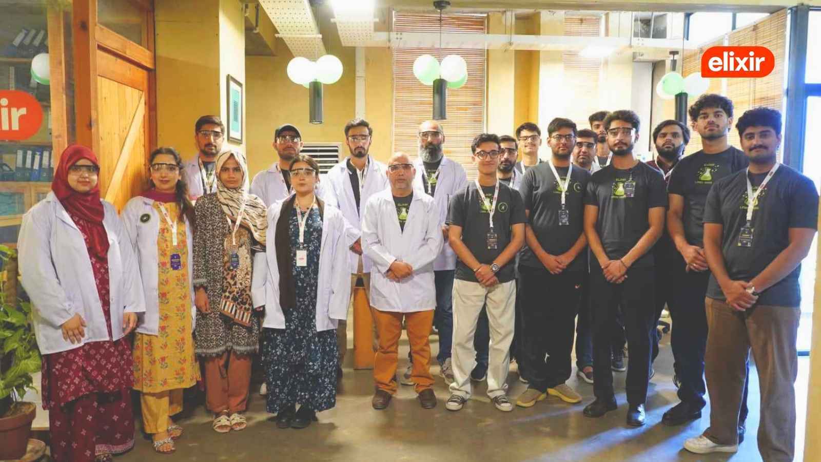 A group of Elixir team members posing for a photo in the Elixir Islamabad office during the 2026 Elixir Labs Hackathon.