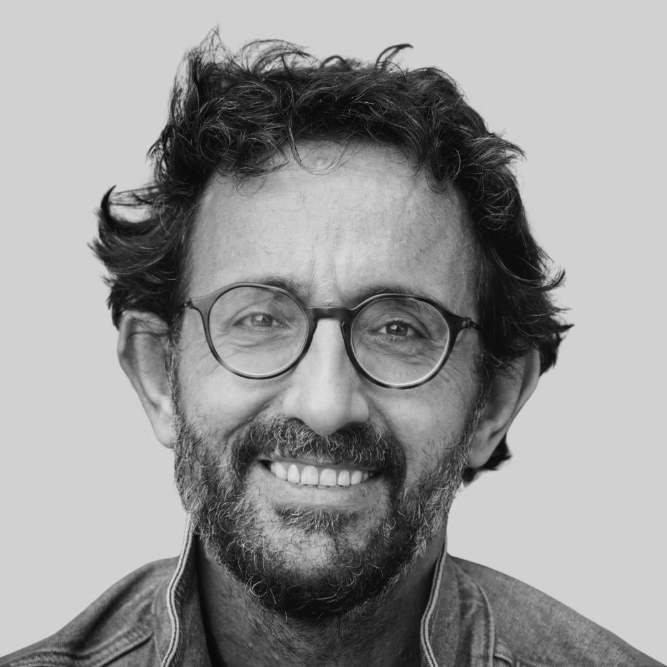 older-man-brown-hair-glasses-beard-smiling-stock-headshot